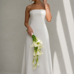 Ivory Falls cascading white calla lily bridal bouquet styled with a modern strapless wedding dress