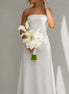 Muse white calla lily and orchid bridal bouquet styled with a modern strapless wedding dress