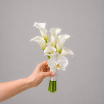 Muse bridesmaid bouquet with white calla lilies and a white orchid