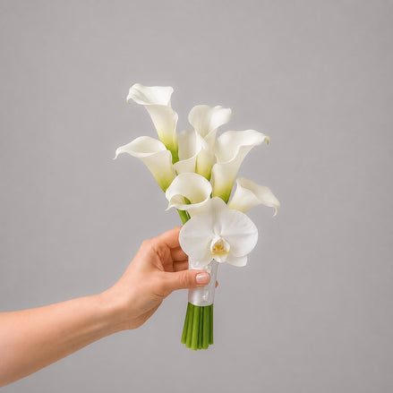 Muse bridesmaid bouquet with white calla lilies and a white orchid