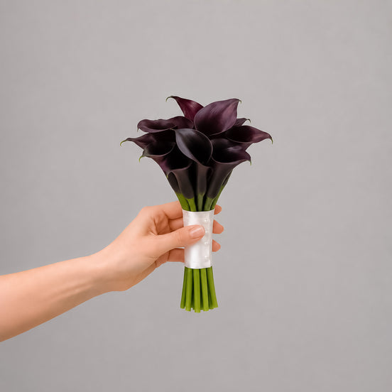 Velvet Night dark calla lily bridesmaid bouquet with white satin ribbon