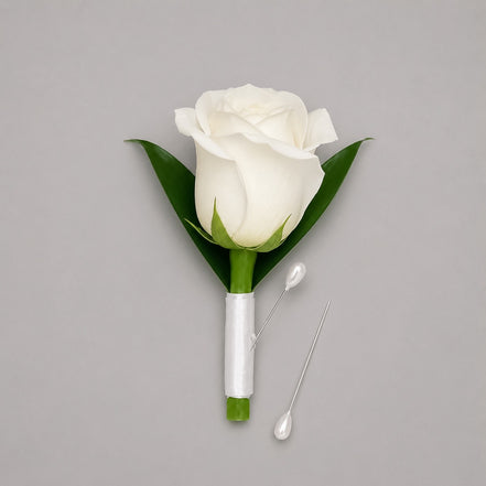 Vow white rose boutonniere with white satin ribbon and pearl pins